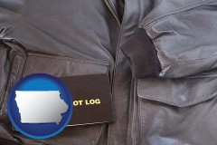 iowa map icon and an leather aviator jacket and pilot log book