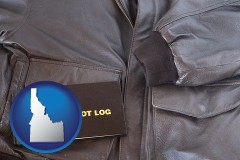 idaho map icon and an leather aviator jacket and pilot log book