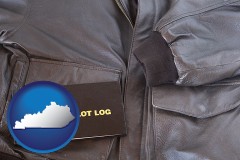 kentucky map icon and an leather aviator jacket and pilot log book