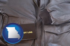 missouri map icon and an leather aviator jacket and pilot log book