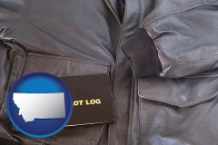 mt map icon and an leather aviator jacket and pilot log book
