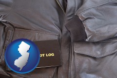 new-jersey map icon and an leather aviator jacket and pilot log book