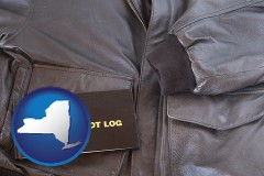 new-york map icon and an leather aviator jacket and pilot log book