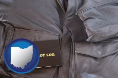 ohio map icon and an leather aviator jacket and pilot log book