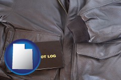 utah map icon and an leather aviator jacket and pilot log book