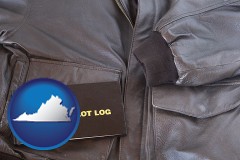 virginia map icon and an leather aviator jacket and pilot log book
