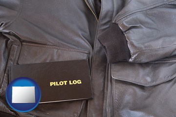 an leather aviator jacket and pilot log book - with Colorado icon
