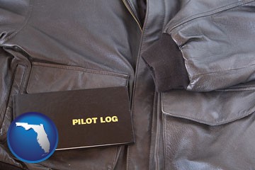 an leather aviator jacket and pilot log book - with Florida icon