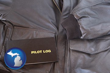an leather aviator jacket and pilot log book - with Michigan icon