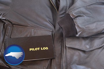 an leather aviator jacket and pilot log book - with North Carolina icon
