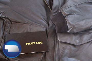 an leather aviator jacket and pilot log book - with Nebraska icon