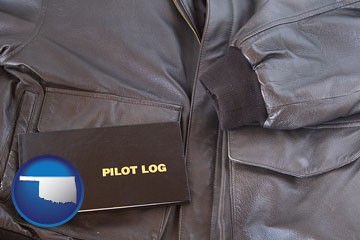 an leather aviator jacket and pilot log book - with Oklahoma icon